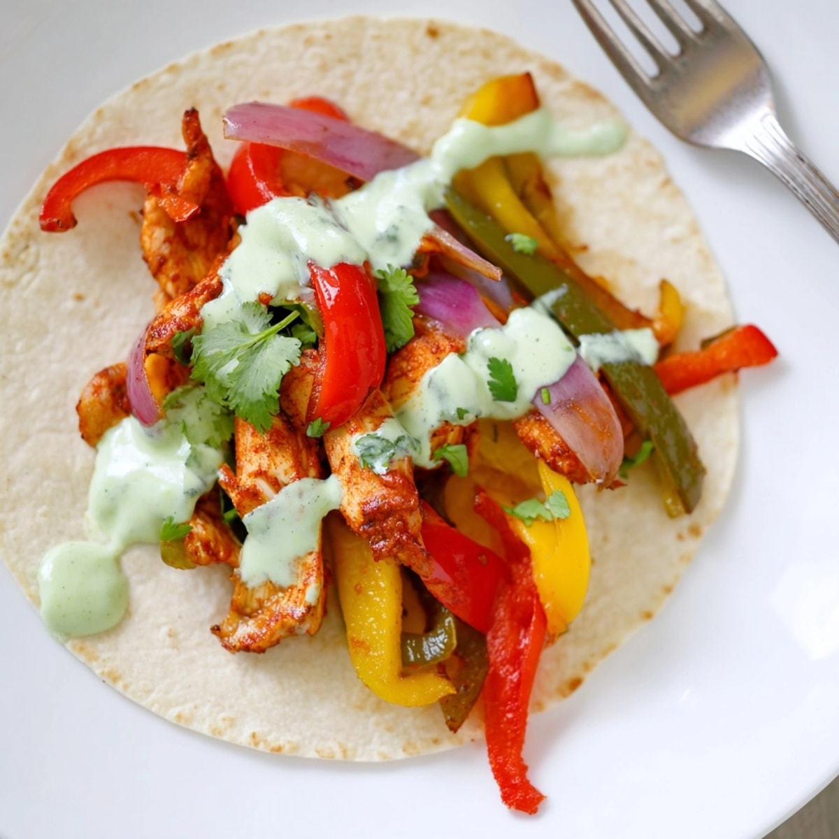 Golden Chicken Fajitas with Lime Crema; imagine juicy chicken and crispy peppers on warm tortillas.