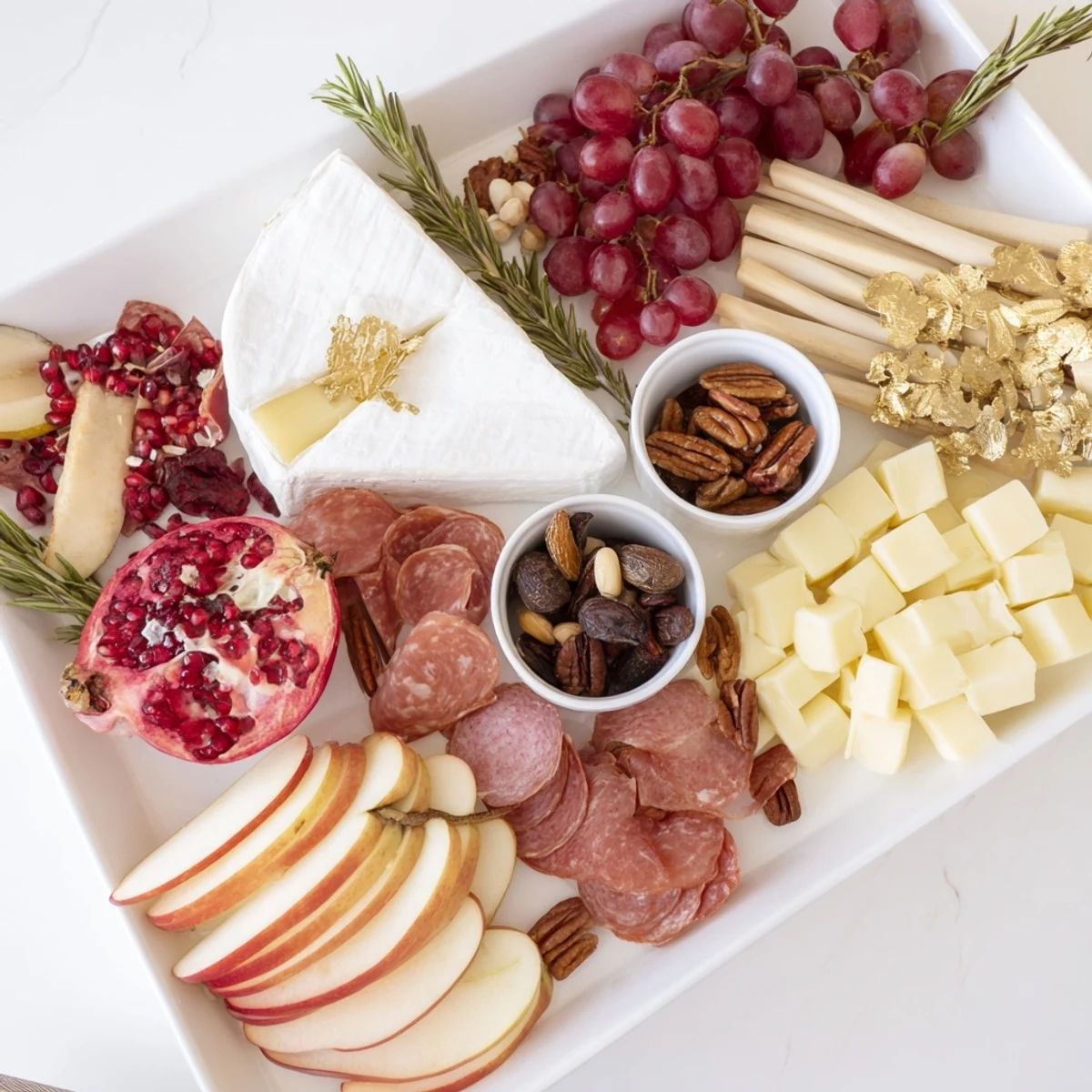 Festive Twelve Days of Christmas Snack Board overflowing with colorful cheeses, fruits, and treats for guests.