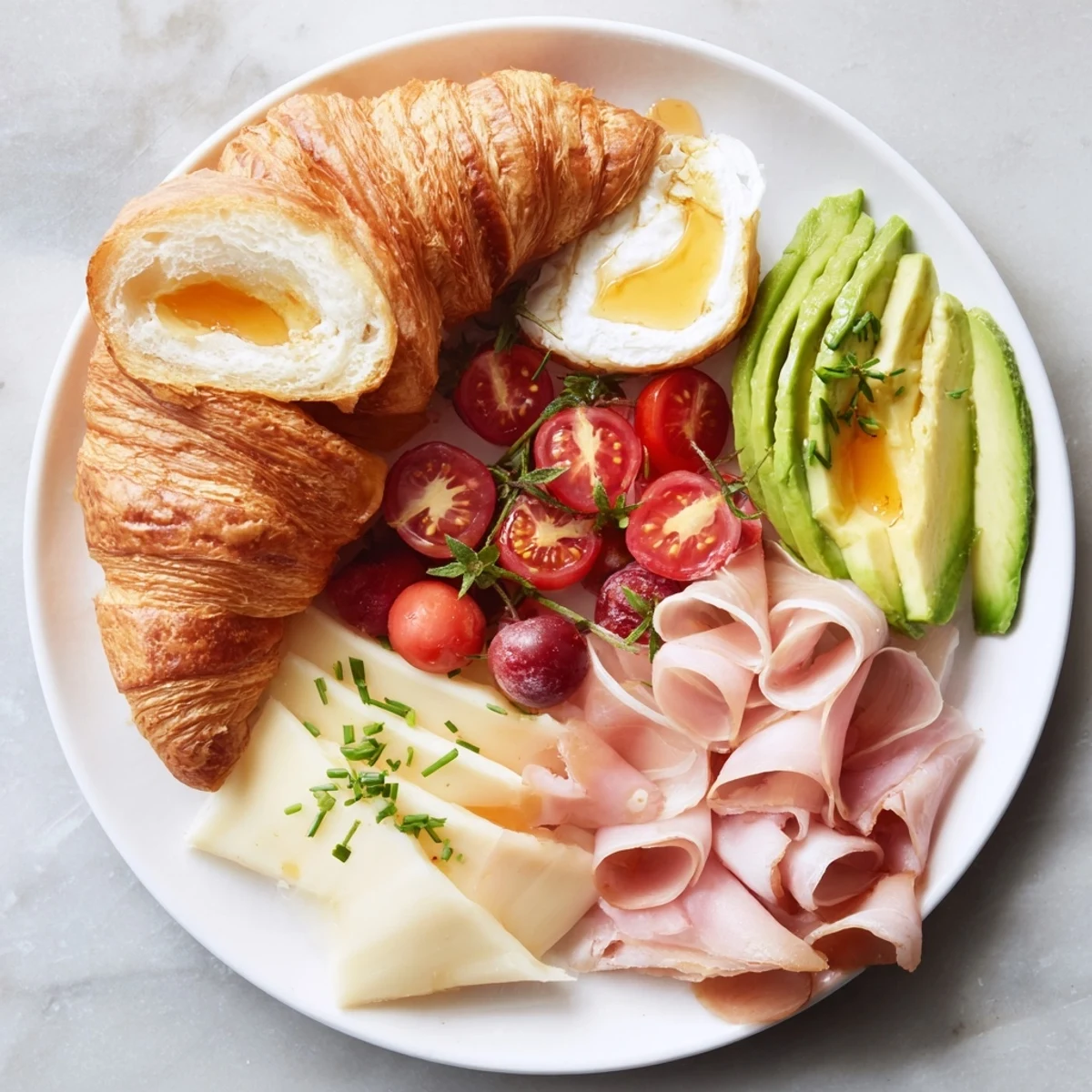 Close-up of a loaded Cozy Fireplace Croissant Board showcasing fresh berries and creamy cheeses.