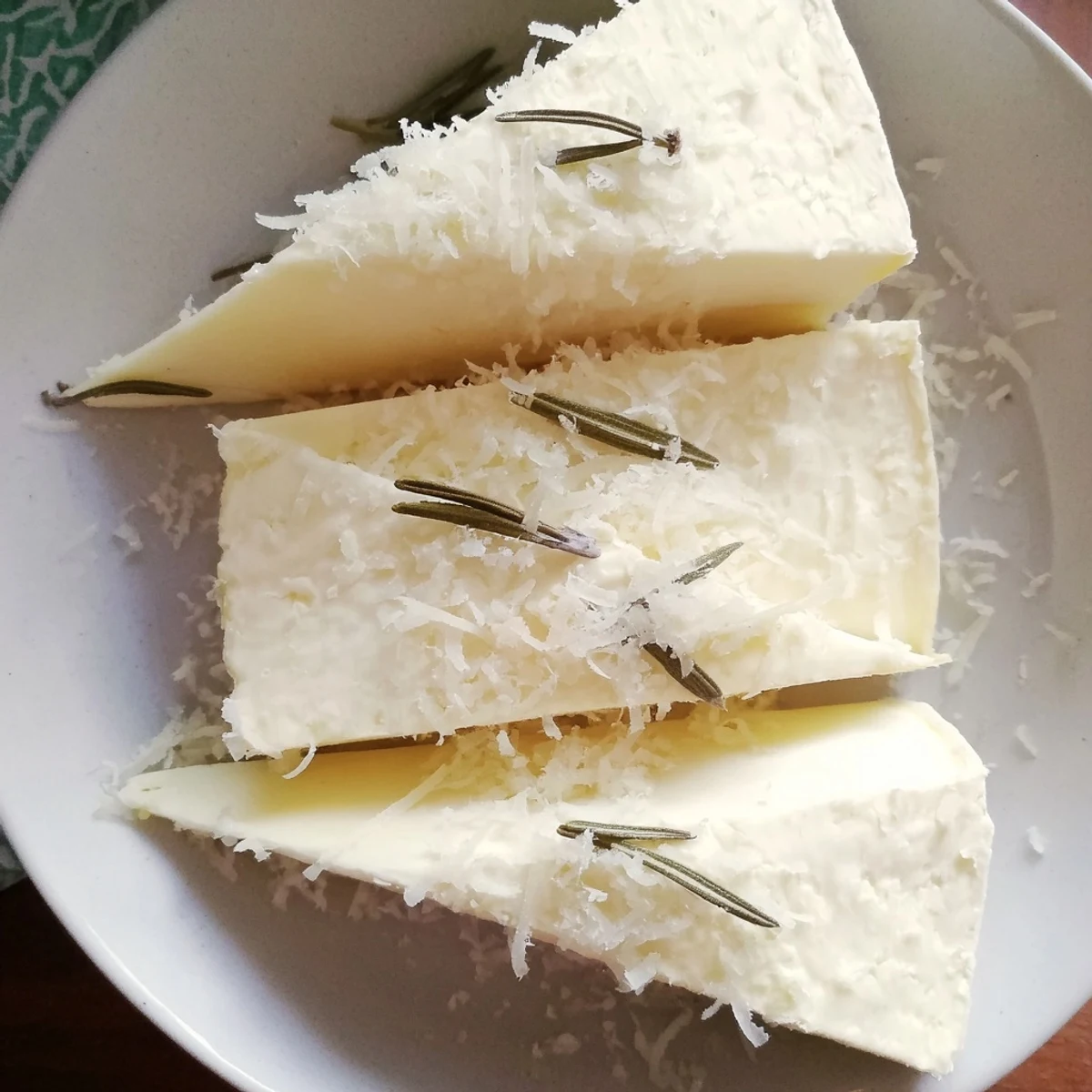Snowcapped Range appetizer: creamy Brie mountains dusted with Parmesan snow, ready to serve.