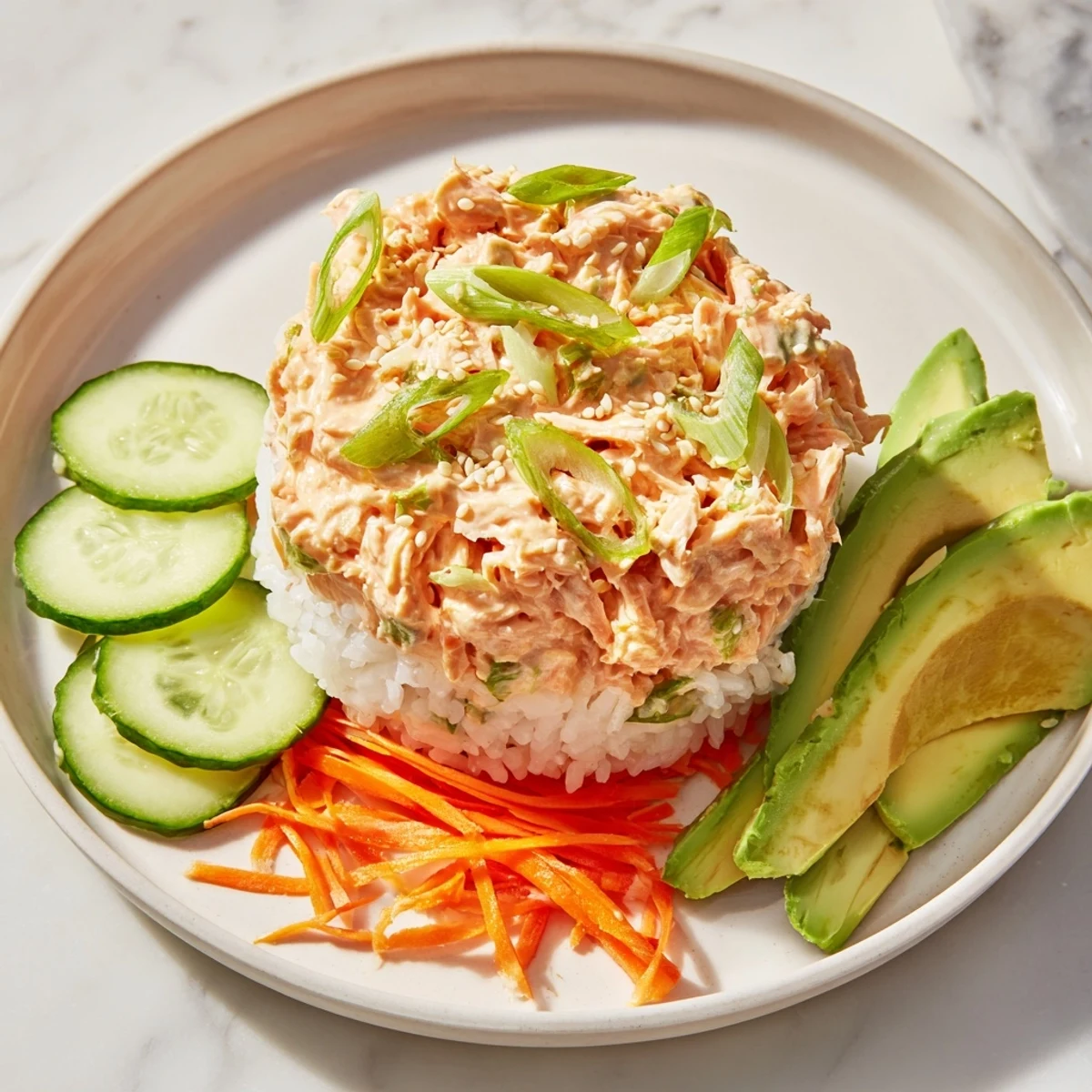 Enjoy the flaky salmon and spicy kick of a Spicy Canned Salmon Rice Bowl, perfect for a quick lunch.