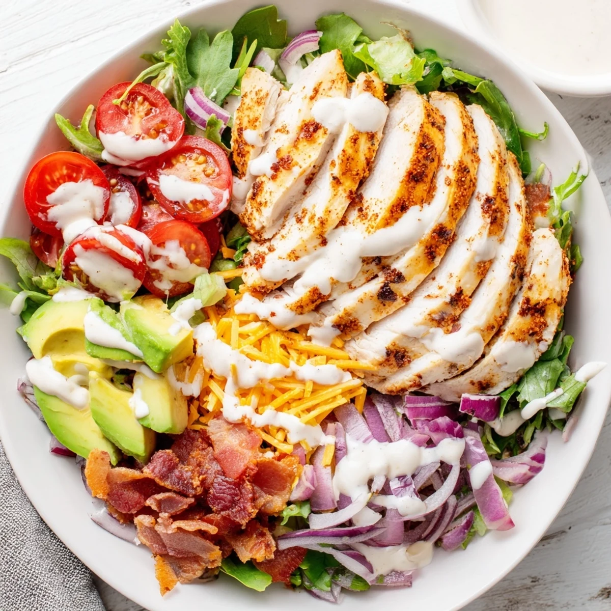 Crispy Bacon Chicken Salad with juicy chicken, crunchy bacon, and fresh greens, ready to eat.