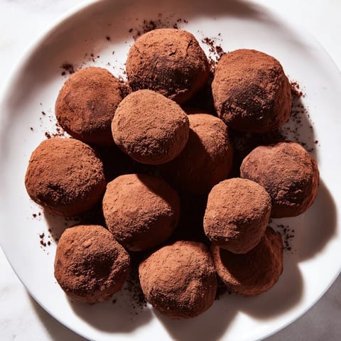 Decadent dark chocolate truffles, a rich, melt-in-your-mouth treat perfect for dessert.