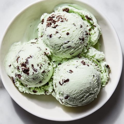 Cool, refreshing mint chocolate chip ice cream, perfect for a summer dessert, waiting to be served.