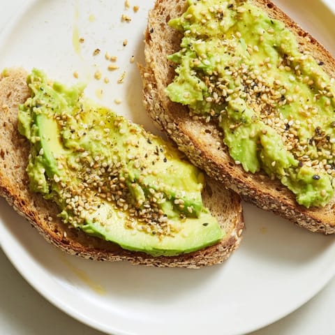 Crispy toasted bread topped with smooth avocado, sprinkled with everything bagel seasoning for avocado toast.
