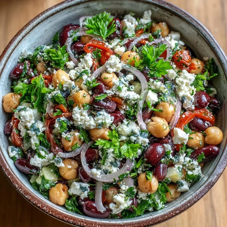 Chilled chickpeas and black beans soak up a zesty red wine vinaigrette for a tangy, make-ahead meal-prep lunch.