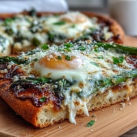 Asparagus and Egg Flatbread with Parmesan, lemon zest, and fresh herbs, perfect for brunch or a light dinner.  