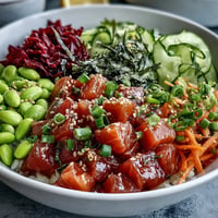 Vibrant Salmon Poke Bowl with creamy avocado, edamame, and fresh veggies.